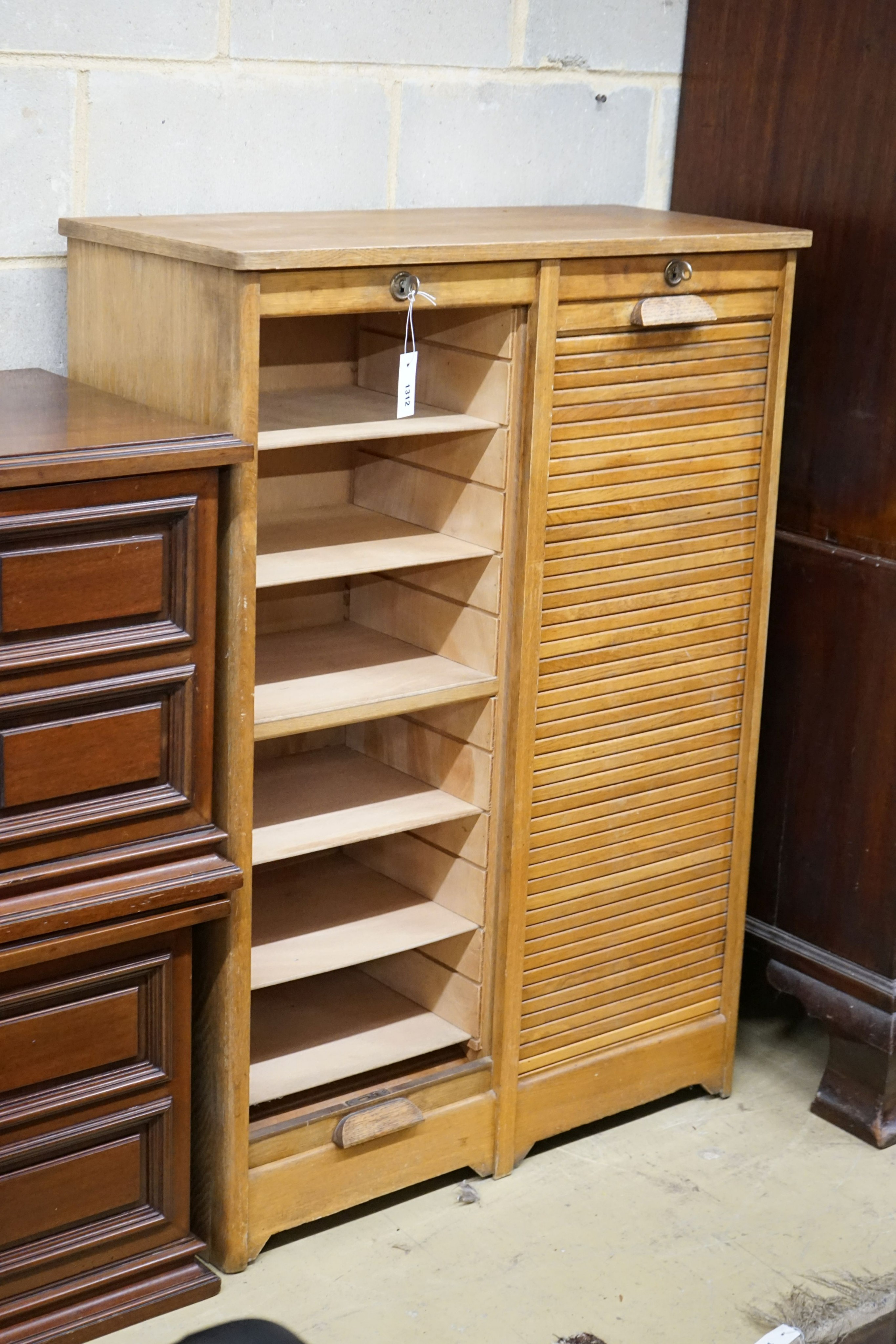 A mid 20th century oak tambour double filing cabinet, width 86cm, depth 38cm, height 120cm